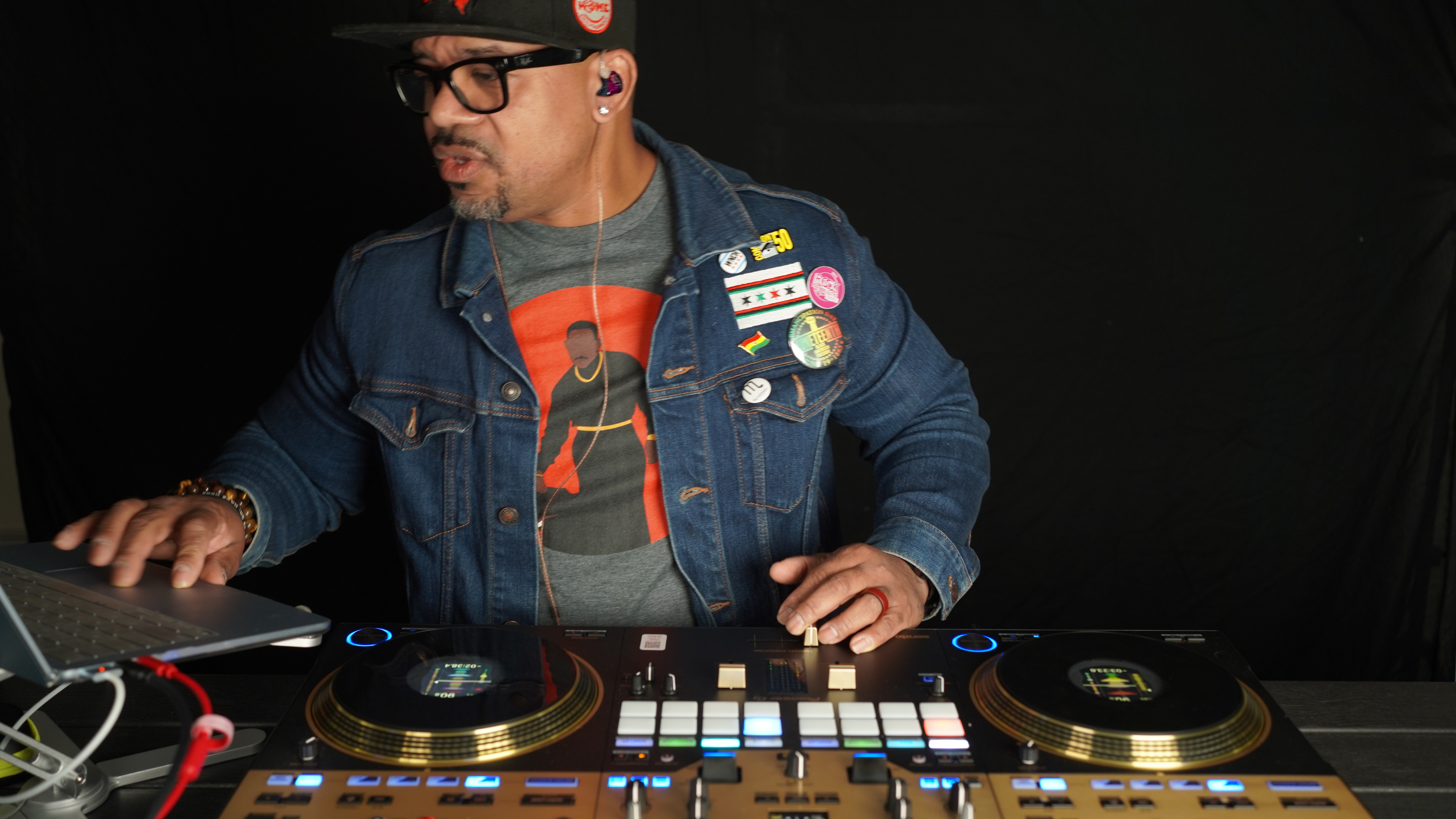 Dame Tha DJ behind the decks